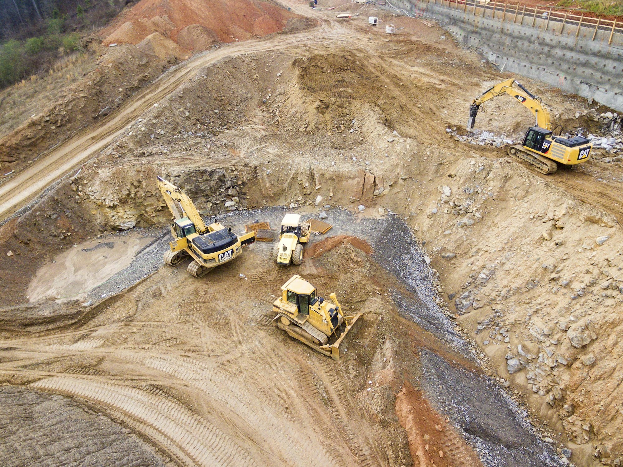 Excavators working an earthworks platform